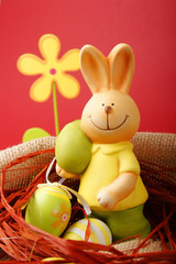 Colorful Easter eggs and a bunny with a flower