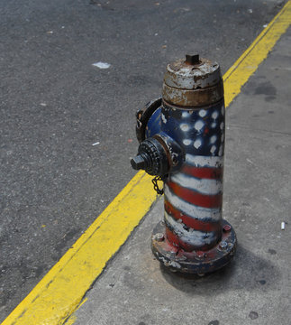 FIRE HOSE WITH AMERICAN FLAG TAG NEAR GROUND ZERO IN NYC