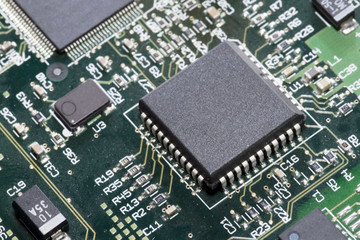 Close-up on a microchip on a scheme background