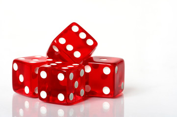 Stack of red and white dice on a white background