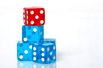 Stack of blue and red dice on a white background