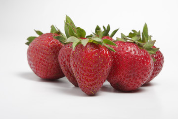 Fresh strawberries on white background low angle