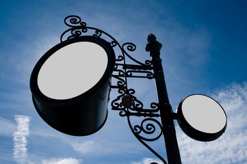 Round billboard under a blue sky