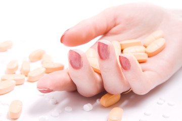 Woman hand with lots of pills