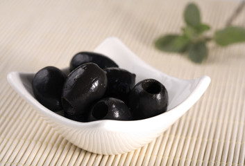 olives in white bowl