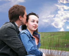 Guy and girl on a grass