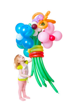 little girl with large balloons 