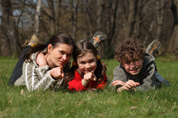 Fototapeta premium Mother with kids resting in park