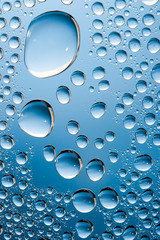 blue water drops on the glass