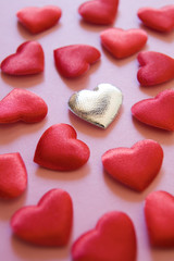 Obraz premium Silver heart amongst red hearts