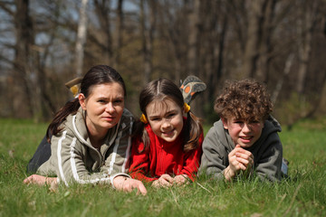 Fototapeta premium Mum with kids in park