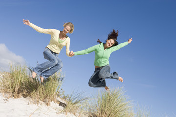 Two young women having fun at beach