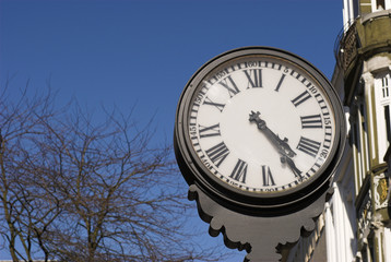 Fototapeta na wymiar Black Clock outside – With Roman Numbers 
