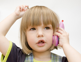  child with a toy telephone