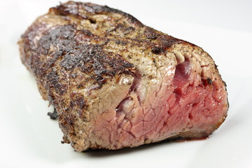 a grilled filet on a white plate
