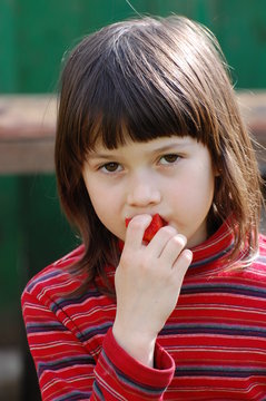 Girl Eating Red Pepper