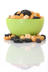 Mixed snacks in a green bowl - vertical