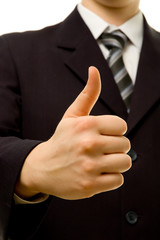 Thumbs up. Businessman showing everything is OK.