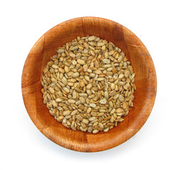 Sunflower seeds in wooden dish 