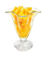 glass with juicy orange fruit pieces isolated on the white