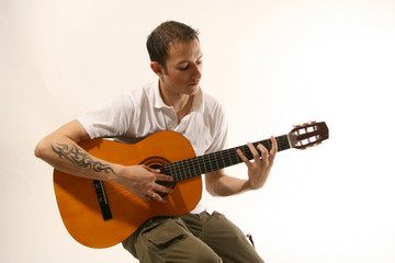 Obraz premium Guitarist - Good Looking Young Man