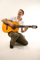 Obraz premium Guitarist - Good Looking Young Man