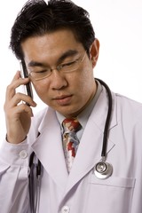 Asian Doctor With Mobile Phone