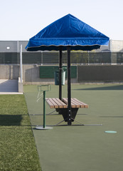 Covered tennis court bench