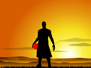 Basketball player at sunset