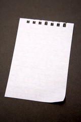 Piece of white paper on black