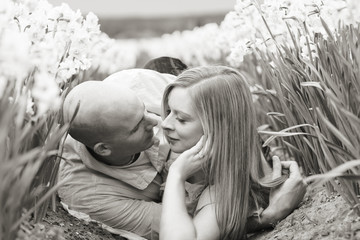 Young couple laying down in field
