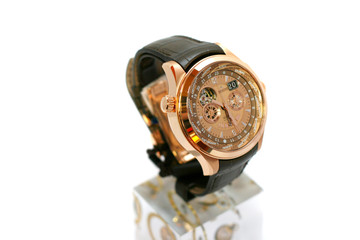 Golden watch with black belt