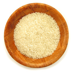 Rice white in wooden dish isolated on