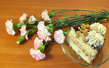 Obraz na płótnie Canvas Flowers and cake