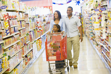 Family shopping in supermarket - Powered by Adobe