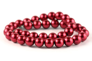 Red beads isolated on a white background.