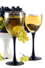Glasses and grapes on a white background