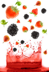 berry falling in juice. Isolation