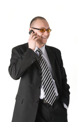 Smiling businessman calling on phone