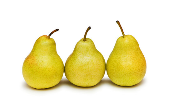 Three yellow pears isolated on the white