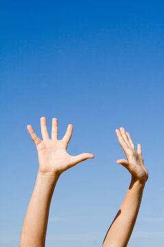 hands raised up in air or sky