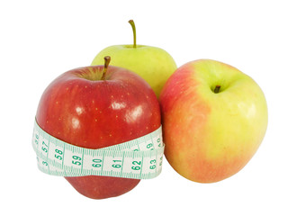 Diet concept with a red apples and a measure tape in centimeters