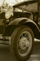 Naklejka premium Antique automobile in grunge distressed image