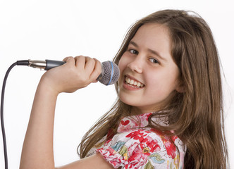 Young girl with microphone singing
