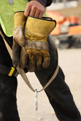Construction Worker Takes Off Gloves After A Days Work