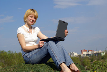 woman is working with notebook
