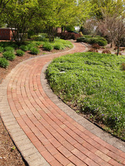 winding brick path in a garden
