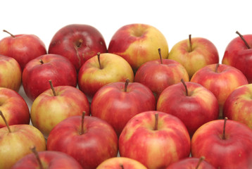 Many red apples on a white background