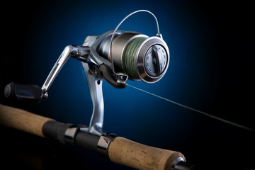 Fishing reel, mounted on a fishing rod