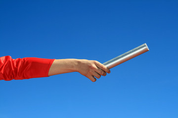 hands passing the batton